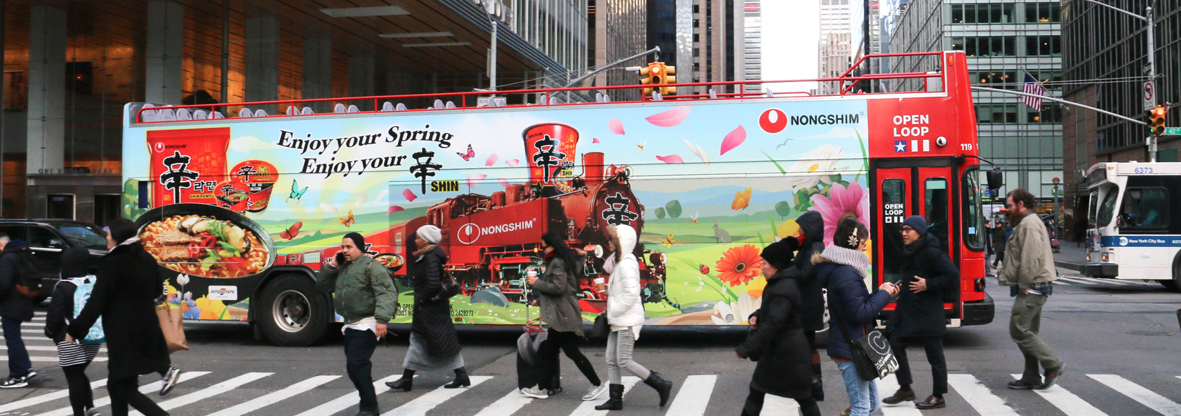 Bus Banner saying Enjoy Your Spring Enjoy Your Shin